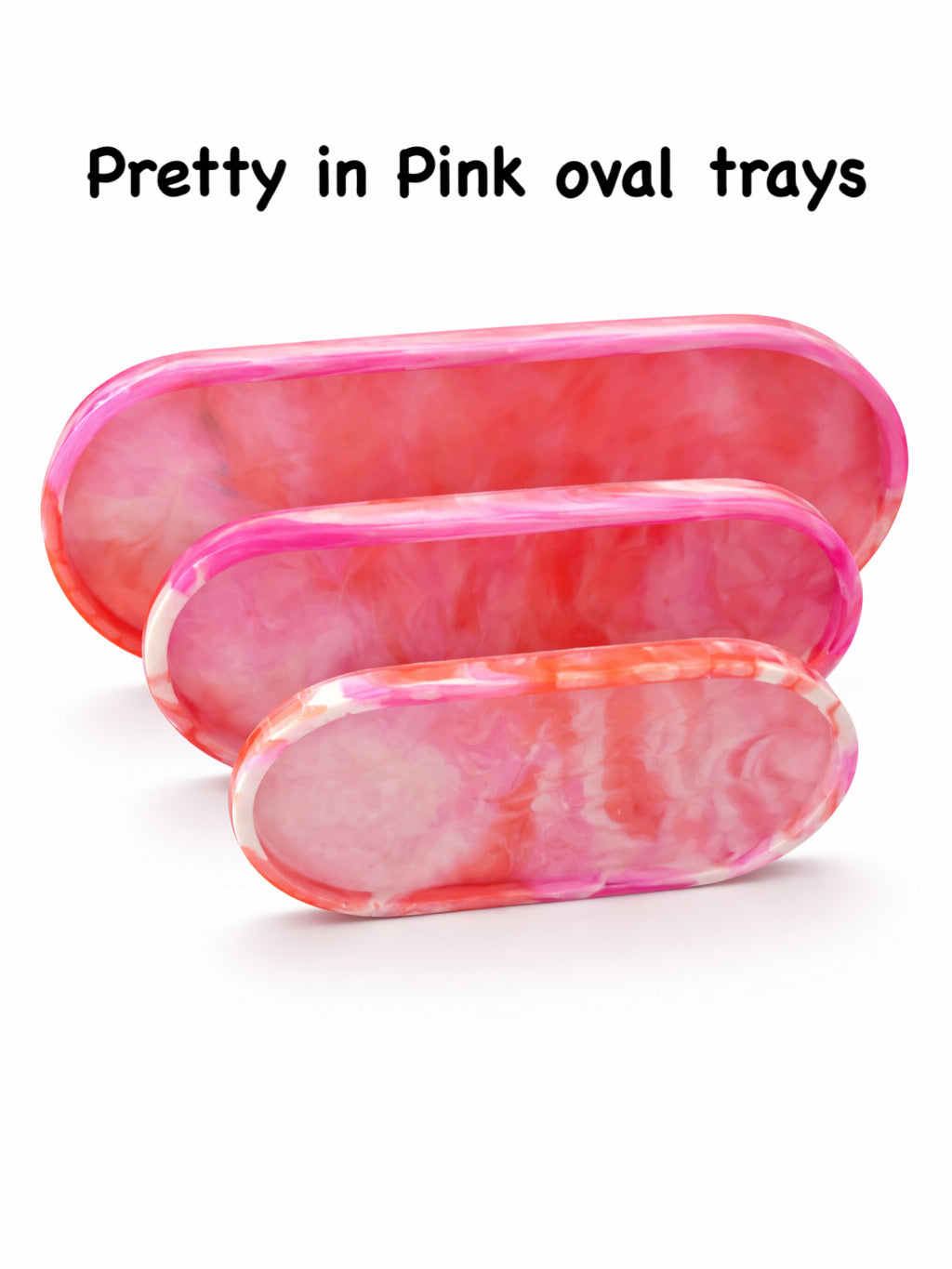 Three pink oval trays with a marbled pattern on a white background.